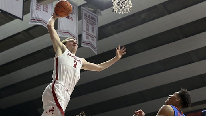 Feb 21, 2024; Tuscaloosa, Alabama, USA;  Alabama Crimson Tide forward Grant Nelson (2) dunks over