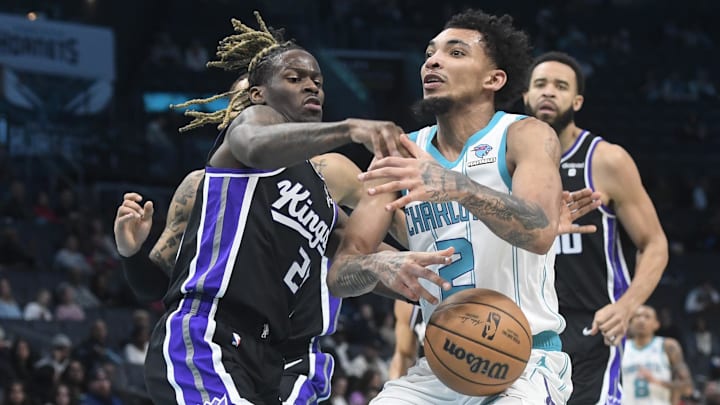 Jan 10, 2024; Charlotte, North Carolina, USA; Charlotte Hornets guard James Bouknight (2) gets the ball stripped by Sacramento Kings wing Keon Ellis (23) during the second half at the Spectrum Center. Mandatory Credit: Sam Sharpe-Imagn Images Jan 10, 2024; Charlotte, North Carolina, USA; Charlotte Hornets guard James Bouknight (2) gets the ball stripped by Sacramento Kings wing Keon Ellis (23) during the second half at the Spectrum Center. Mandatory Credit: Sam Sharpe-Imagn Images