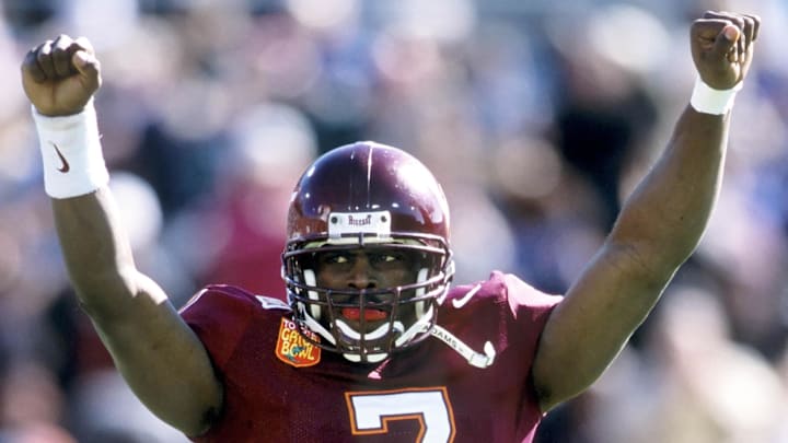 Jan 1, 2001; Jacksonville, FL, USA: FILE PHOTO; Virginia Tech Hokies quarterback Michael Vick (7) celebrates against the Clemson Tigers during the 2001 Gator Bowl at Alltel Stadium. Mandatory Credit: Imagn Images Jan 1, 2001; Jacksonville, FL, USA: FILE PHOTO; Virginia Tech Hokies quarterback Michael Vick (7) celebrates against the Clemson Tigers during the 2001 Gator Bowl at Alltel Stadium. Mandatory Credit: Imagn Images