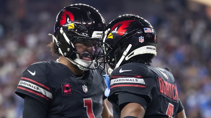 Oct 21, 2024; Glendale, Arizona, USA; Arizona Cardinals wide receiver Greg Dortch (4) celebrates a touchdown pass with quarterback Kyler Murray (1) against the Los Angeles Chargers in the first half at State Farm Stadium. Mandatory Credit: Mark J. Rebilas-Imagn Images