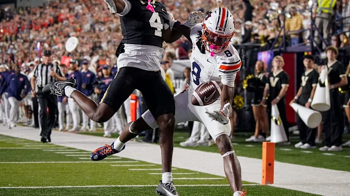 Auburn wide receiver Cam Coleman (8) receives a pass to pull in a touchdown past Vanderbilt cornerback Martel Hight (4)