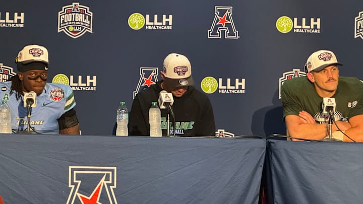 Jack Tchienchou (left), Jon Sumrall (middle), and Jake Retzlaff (right) seated for the post-game AAC Championship conference.