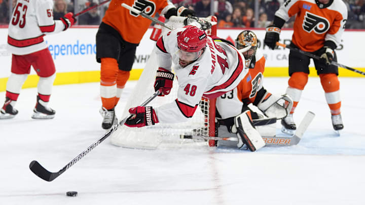 Mar 15, 2025; Philadelphia, Pennsylvania, USA; Carolina Hurricanes left wing Jordan Martinook (48) dives for the puck against the Philadelphia Flyers in the third period at Wells Fargo Center. Mandatory Credit: Kyle Ross-Imagn Images Mar 15, 2025; Philadelphia, Pennsylvania, USA; Carolina Hurricanes left wing Jordan Martinook (48) dives for the puck against the Philadelphia Flyers in the third period at Wells Fargo Center. Mandatory Credit: Kyle Ross-Imagn Images