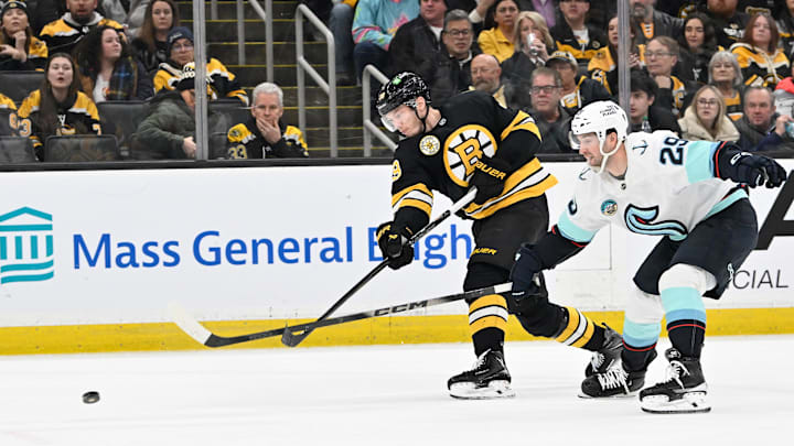 Jan 15, 2026; Boston, Massachusetts, USA; Boston Bruins center Morgan Geekie (39) shoots the puck through the check of Seattle Kraken defenseman Vince Dunn (29) during the third period at TD Garden. Mandatory Credit: Eric Canha-Imagn Images Jan 15, 2026; Boston, Massachusetts, USA; Boston Bruins center Morgan Geekie (39) shoots the puck through the check of Seattle Kraken defenseman Vince Dunn (29) during the third period at TD Garden. Mandatory Credit: Eric Canha-Imagn Images