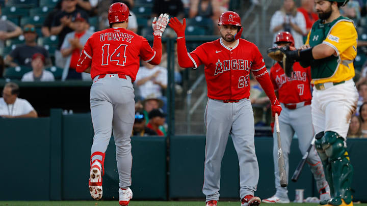 May 20, 2025; West Sacramento, California, USA; Los Angeles Angels designated hitter Logan O'Hoppe (14) is congratulated by catcher Travis d'Arnaud (25) after hitting a one run home run during the fourth inning against the Athletics at Sutter Health Park. Mandatory Credit: Sergio Estrada-Imagn Images