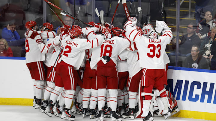 Mar 29, 2025; Toledo, OH, USA;  Boston University forward Quinn Hutson (17) receives congratulations from teammates after scoring the winning goal in overtime against the Cornell at Huntington Center. Mandatory Credit: Rick Osentoski-Imagn Images