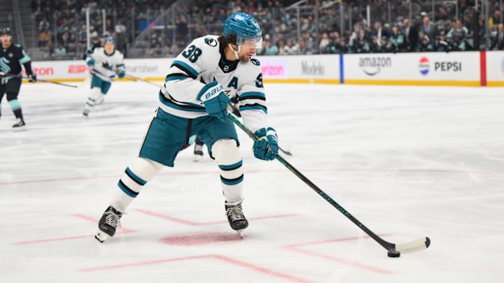 Jan 30, 2025; Seattle, Washington, USA; San Jose Sharks defenseman Mario Ferraro (38) plays the puck during the first period against the Seattle Kraken at Climate Pledge Arena. Mandatory Credit: Steven Bisig-Imagn Images