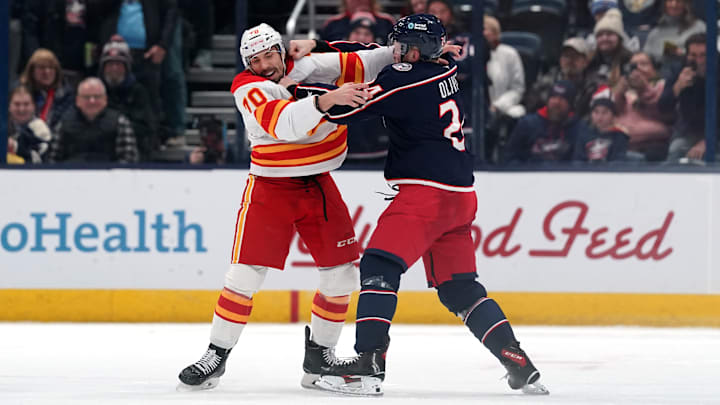 Blue Jackets winger Mathieu Olivier fights Flames forward Ryan Lomberg. Blue Jackets winger Mathieu Olivier fights Flames forward Ryan Lomberg.