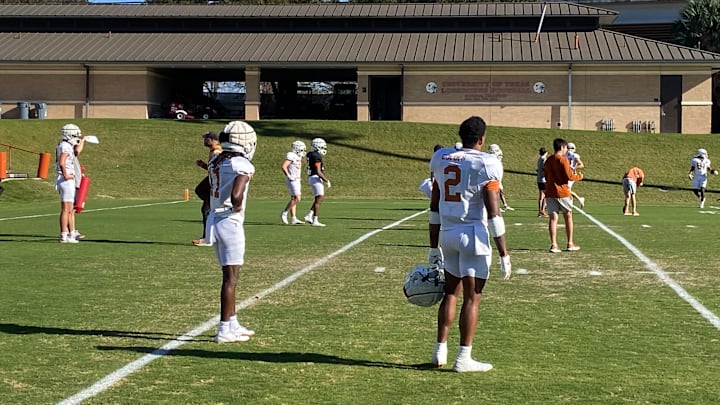 Texas receivers Silas Bolden (left) and Matthew Golden look on during an open practice window ahead of the Cotton Bowl.