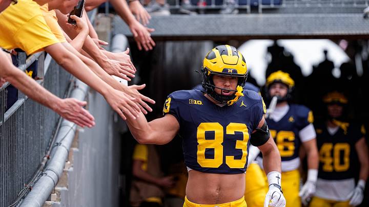 Michigan tight end Zack Marshall (83) high-fives fans before practice at Michigan Stadium in Ann Arbor ahead of the game between Michigan and Oklahoma on Saturday, Sept. 12, 2026. Michigan tight end Zack Marshall (83) high-fives fans before practice at Michigan Stadium in Ann Arbor ahead of the game between Michigan and Oklahoma on Saturday, Sept. 12, 2026.