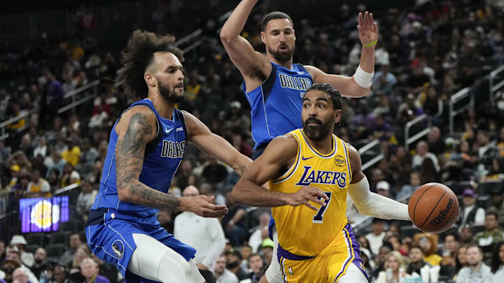 Oct 15, 2025; Las Vegas, Nevada, USA; Los Angeles Lakers guard Gabe Vincent (7) drives the ball past Dallas Mavericks center Dereck Lively II (2) and guard Klay Thompson (31) during the second half at T-Mobile Arena. Mandatory Credit: Lucas Peltier-Imagn Images Oct 15, 2025; Las Vegas, Nevada, USA; Los Angeles Lakers guard Gabe Vincent (7) drives the ball past Dallas Mavericks center Dereck Lively II (2) and guard Klay Thompson (31) during the second half at T-Mobile Arena. Mandatory Credit: Lucas Peltier-Imagn Images