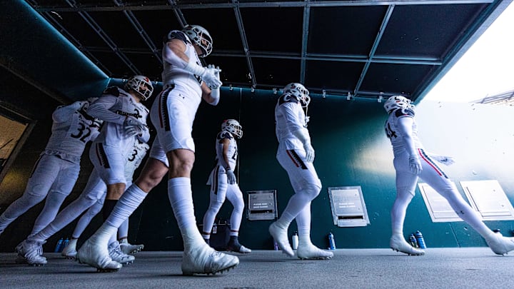 Nov 19, 2022; Philadelphia, Pennsylvania, USA; The Cincinnati Bearcats walk out of the tunnel for a game against the Temple Owls at Lincoln Financial Field. Mandatory Credit: Bill Streicher-Imagn Images Nov 19, 2022; Philadelphia, Pennsylvania, USA; The Cincinnati Bearcats walk out of the tunnel for a game against the Temple Owls at Lincoln Financial Field. Mandatory Credit: Bill Streicher-Imagn Images