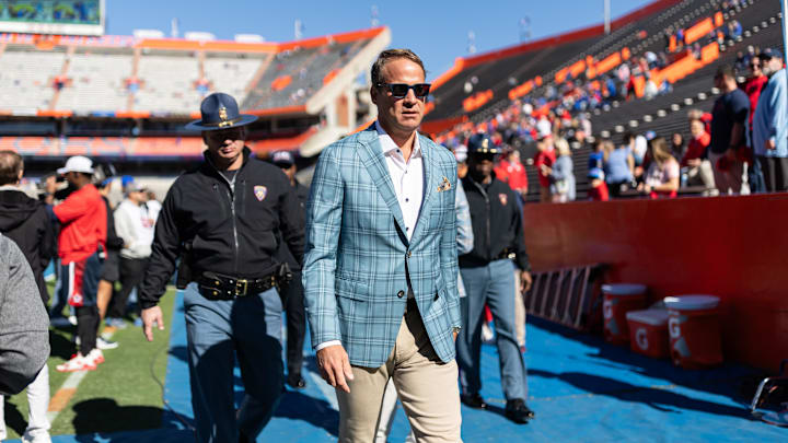 Nov 23, 2024; Gainesville, Florida, USA; Mississippi Rebels head coach Lane Kiffin walks off the field before a game against the Florida Gators at Ben Hill Griffin Stadium. Mandatory Credit: Matt Pendleton-Imagn Images