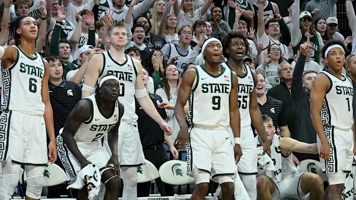 Nov 21, 2025; East Lansing, Michigan, USA;  The Michigan State Spartan bench reacts against the Detroit Mercy Titans at the end of the game at Jack Breslin Student Events Center. Mandatory Credit: Dale Young-Imagn Images
