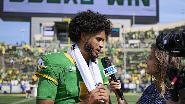 Aug 30, 2025; Eugene, Oregon, USA; Oregon Ducks quarterback Dante Moore (5) talks to the media after a game against the Montana State Bobcats at Autzen Stadium. Mandatory Credit: Troy Wayrynen-Imagn Images