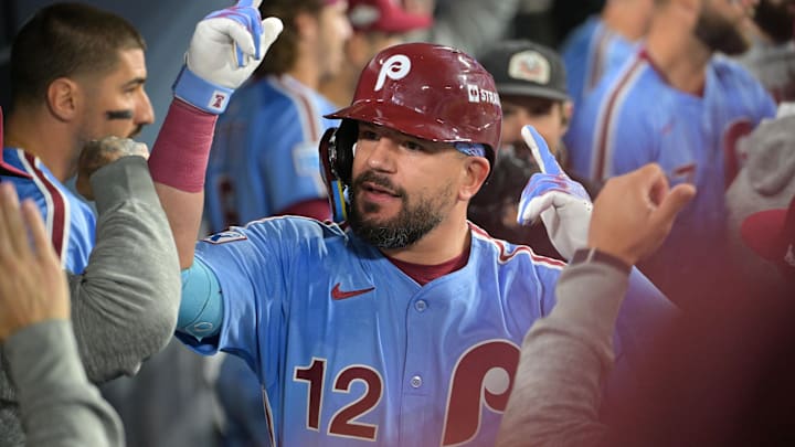 Oct 8, 2025; Los Angeles, California, USA; Philadelphia Phillies designated hitter Kyle Schwarber (12) celebrates in the dugout after hitting a solo home run during the fourth inning against the Los Angeles Dodgers during game three of the NLDS round for the 2025 MLB playoffs at Dodger Stadium. 