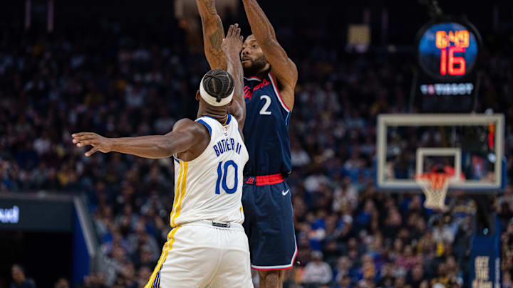 Oct 28, 2025; San Francisco, California, USA: LA Clippers forward Kawhi Leonard (2) shoots the basketball over Golden State Warriors forward Jimmy Butler III (10) during the second quarter at Chase Center. Mandatory Credit: Neville E. Guard-Imagn Images