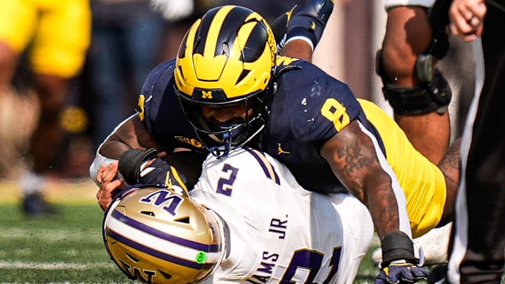 Michigan edge Derrick Moore (8).