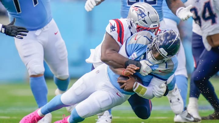 Tennessee Titans quarterback Cam Ward taking a sack