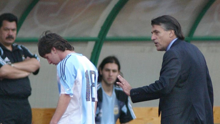 Argentine's Lionel Messi (C) is comforte