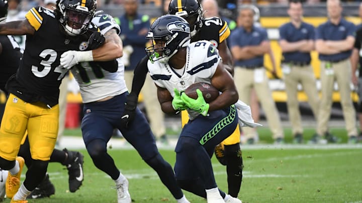 Aug 13, 2022; Pittsburgh, Pennsylvania, USA; Seattle Seahawks running back Kenneth Walker III (9) is pursued by Pittsburgh Steelers safety Terrell Edmunds (34) during the first quarter at Acrisure Stadium.