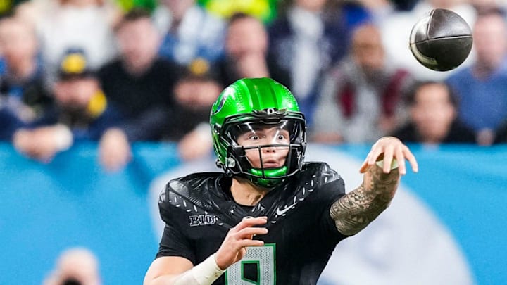 Oregon Ducks quarterback Dillon Gabriel (8) throws a pass Saturday, Dec. 7, 2024, during the Big Ten Championship game between the Oregon Ducks and the Penn State Nittany Lions at Lucas Oil Stadium in Indianapolis. The Ducks defeated the Nittany Lions, 45-37.