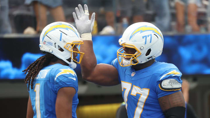 Zion Johnson and Quentin Johnston celebrate for the Chargers.