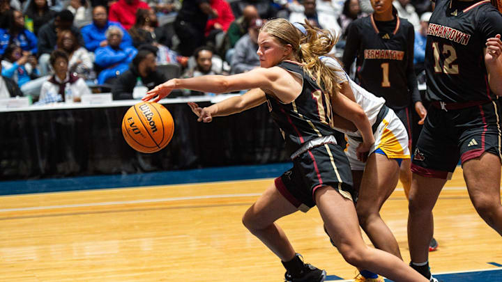 Germantown Lady Mavericks' guard Julia Glasgow (10) and Tupelo Lady Wave's shooting guard Jade Rucker (11) go for the ball during the MHSAA Class 7A state final game at the Mississippi Coliseum in Jackson, Miss., on Saturday, Mar. 2, 2024.