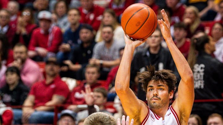 Indiana senior guard Trey Galloway (32) shoots against Iowa during a 2024 game.