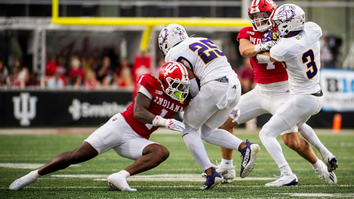 Indiana's Shaun Asbury II (1) tackles Western Illinois' Cameren Smith (25) during the Indiana versus Western Illinois football game at Memorial Stadium on Friday, Sept. 6, 2024.
