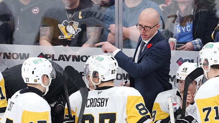 Nov 1, 2025; Winnipeg, Manitoba, CAN; Pittsburgh Penguins head coach Dan Muse instructs players during a time out against the Winnipeg Jets in the third period at Canada Life Centre. Mandatory Credit: James Carey Lauder-Imagn Images