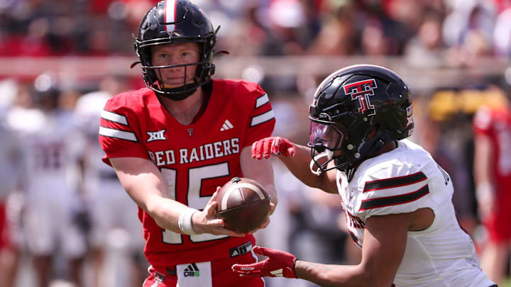 Will Hammond (15) hands off to Quinten Joyner during the Texas Tech football team's spring game, Saturday, April 19, 2025, at Jones AT&T Stadium.