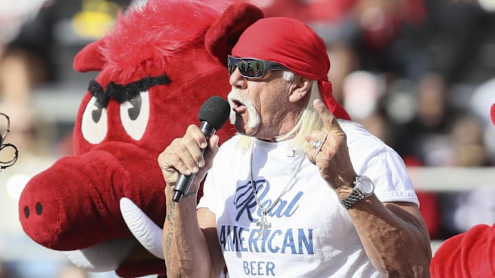 Nov 16, 2024; Fayetteville, Arkansas, USA; Hulk Hogan and an Arkansas Razorbacks mascot hype the crowd during the first quarter against the Texas Longhorns at Donald W. Reynolds Razorback Stadium. Mandatory Credit: Nelson Chenault-Imagn Images