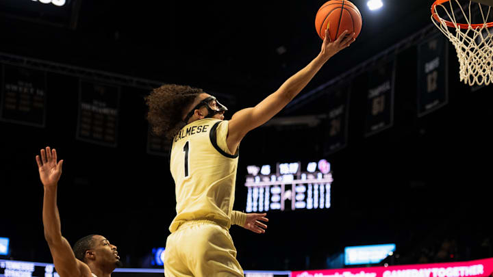 Wake Forest guard Nate Calmese takes ball to the basket against Oklahoma Wake Forest guard Nate Calmese takes ball to the basket against Oklahoma