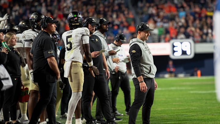 Wake Forest head coach Jake Dickert and staff look on against Virginia 