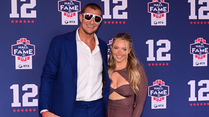 Jun 12, 2024; Foxborough, MA, USA; Retired NFL tight end Rob Gronkowski poses for photos with his girlfriend Camille Kostek during the New England Patriots Hall of Fame induction Ceremony for Tom Brady Jun 12, 2024; Foxborough, MA, USA; Retired NFL tight end Rob Gronkowski poses for photos with his girlfriend Camille Kostek during the New England Patriots Hall of Fame induction Ceremony for Tom Brady