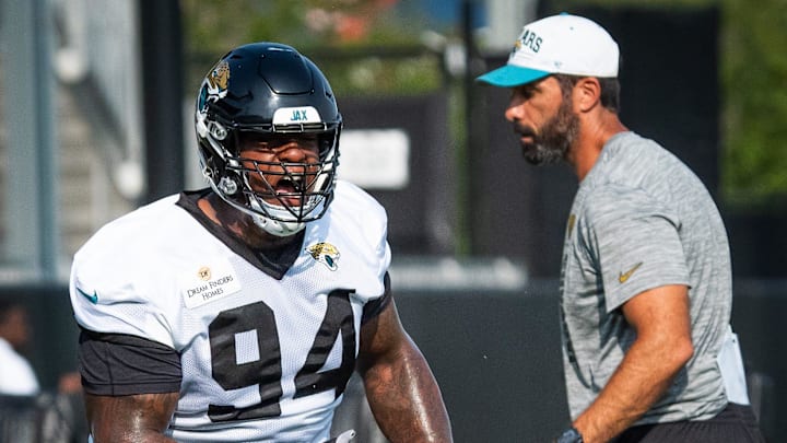 Jacksonville Jaguars defensive tackle Maason Smith (94) runs through tackling drills during the seventh organized team activity at the Miller Electric Center in Jacksonville, Fla. Monday, June 2, 2025. [Doug Engle/Florida Times-Union]