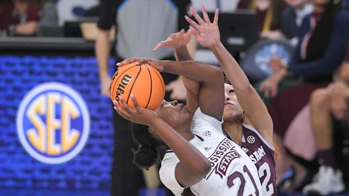 Mar 1, 2023; Greenville, SC, USA; Mississippi State guard Debreasha Powe (21) shoots near Texas A&M forward Aaliyah Patty (32) during the first quarter of the SEC Women's Basketball Tournament at Bon Secours Wellness Arena. Mandatory Credit: Ken Ruinard-Imagn Images