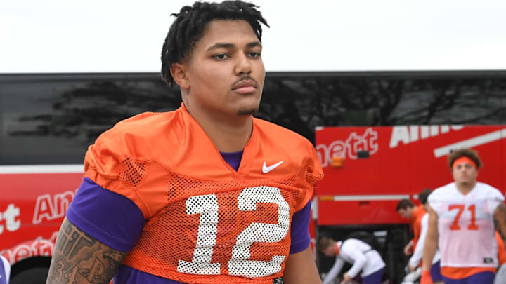 Clemson defensive lineman T.J. Parker (12) arrives with the team before football team practice before the TaxSlayer Gator Bowl at Fernandina Beach High School in Jacksonville, Florida, Wednesday, December 27, 2023.