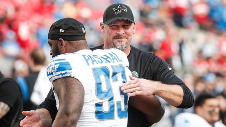 Lions coach Dan Campbell hugs defensive lineman Josh Paschal. Lions coach Dan Campbell hugs defensive lineman Josh Paschal.