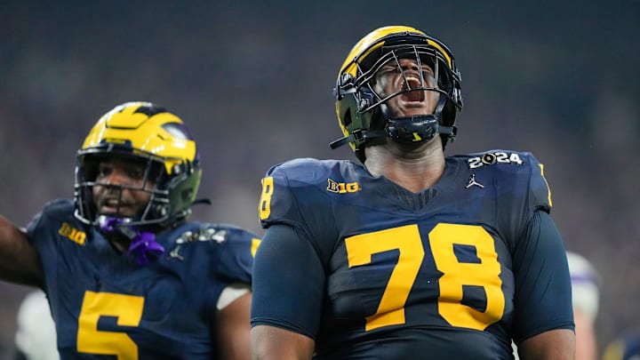Michigan defensive lineman Kenneth Grant celebrates a sack on Washington quarterback Michael Penix Jr. during the College Football Playoff national championship game against Washington at NRG Stadium in Houston, Texas, on Monday, Jan. 8, 2024.