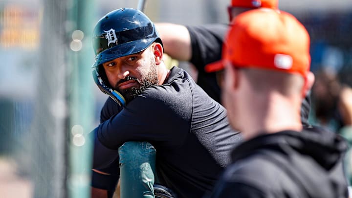 Detroit Tigers outfielder Riley Greene talks to his hitting coach. 
