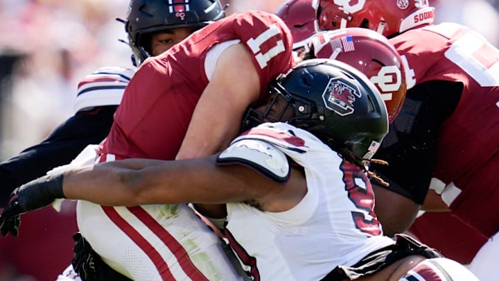 South Carolina Gamecocks defensive tackle T.J. Sanders (90) sacks Oklahoma Sooners quarterback Jackson Arnold. South Carolina Gamecocks defensive tackle T.J. Sanders (90) sacks Oklahoma Sooners quarterback Jackson Arnold.