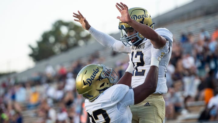 UC Davis Aggies quarterback Caden Pinnick (12) celebrates his touchdown run as Mercer Bears take on UC Davis Aggies during the FCS Kickoff Game at Cramton Bowl in Montgomery, Ala. on Saturday, Aug. 23, 2025.