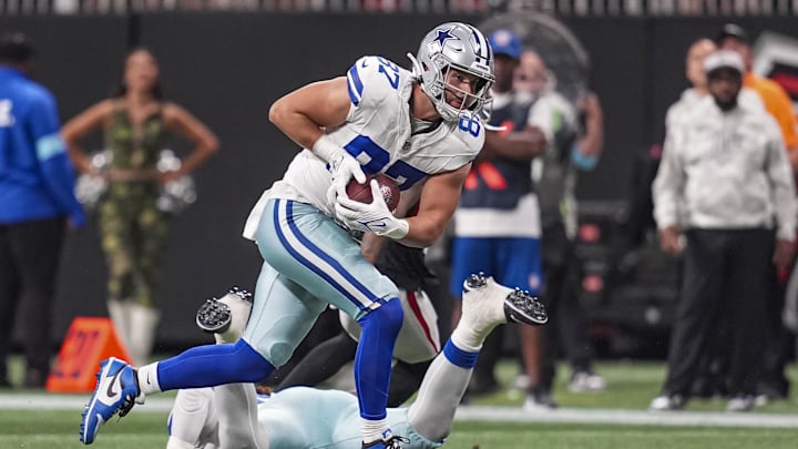 Dallas Cowboys tight end Jake Ferguson runs after a catch against the Atlanta Falcons during the second half at Mercedes-Benz Stadium. 