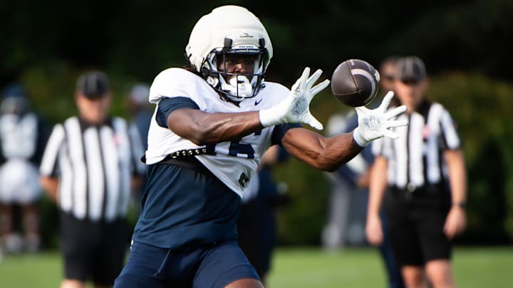 Penn State tight end Khalil Dinkins catches a pass during practice at Holuba Hall. Penn State tight end Khalil Dinkins catches a pass during practice at Holuba Hall.