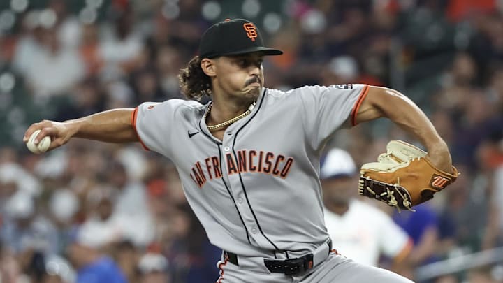 Mar 31, 2025; Houston, Texas, USA; San Francisco Giants starting pitcher Jordan Hicks (12) pitches against the Houston Astros in the first inning  at Daikin Park.