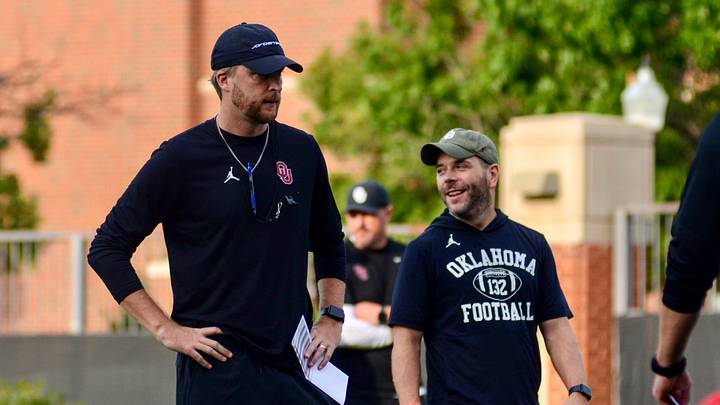 Oklahoma offensive coordinator Ben Arbuckle overlooks as the Sooners stretch before practice. Oklahoma offensive coordinator Ben Arbuckle overlooks as the Sooners stretch before practice.
