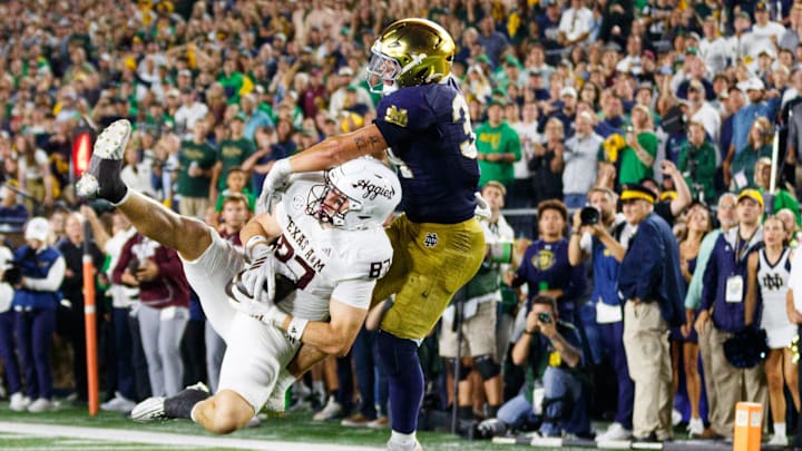Texas A&M tight end Nate Boerkircher, left, catches a pass in the end zone to tie the game with Notre Dame linebacker Drayk Bowen, right, defending in the second half of a NCAA football game at Notre Dame Stadium on Saturday, Sept. 13, 2025, in South Bend. The extra point scored after this touchdown put Texas A&M ahead 41-40 to win the game. Texas A&M tight end Nate Boerkircher, left, catches a pass in the end zone to tie the game with Notre Dame linebacker Drayk Bowen, right, defending in the second half of a NCAA football game at Notre Dame Stadium on Saturday, Sept. 13, 2025, in South Bend. The extra point scored after this touchdown put Texas A&M ahead 41-40 to win the game.