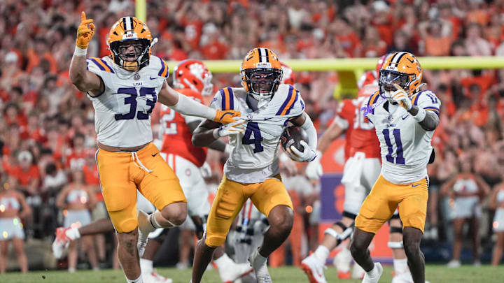 Louisiana State University linebacker West Weeks (33), cornerback Mansoor Delane (4) and cornerback PJ Woodland (11) react playing Clemson during the third quarter at Memorial Stadium in Clemson, S.C. Saturday, August 31, 2025. Louisiana State University linebacker West Weeks (33), cornerback Mansoor Delane (4) and cornerback PJ Woodland (11) react playing Clemson during the third quarter at Memorial Stadium in Clemson, S.C. Saturday, August 31, 2025.